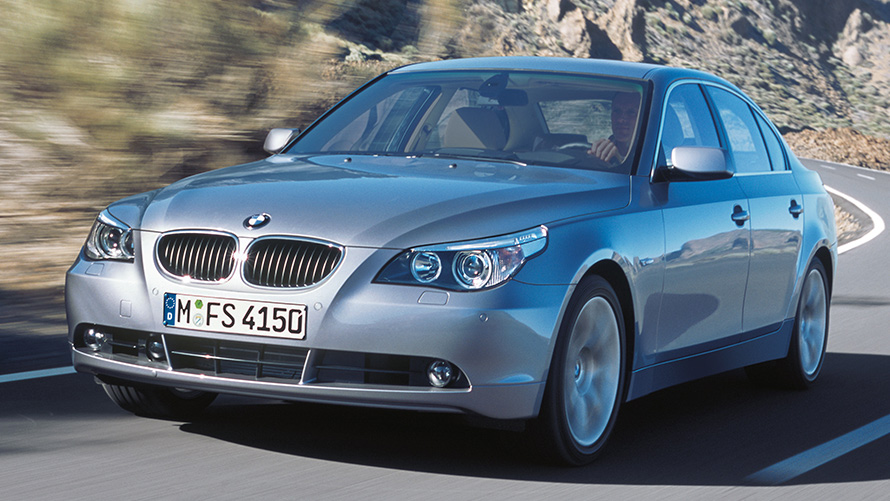 BMW 5 Series Sedan (E60) three-quarter front view driving BMW 5 Series Sedan (E60) three-quarter front view driving