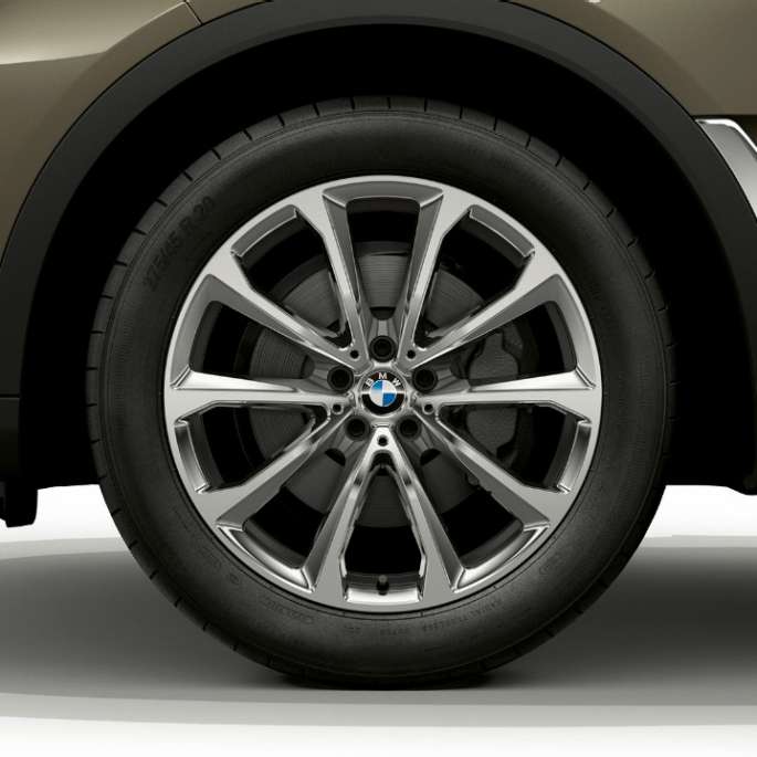Close-up of the light alloy wheel of the BMW X7 SUV G07 with standard equipment features